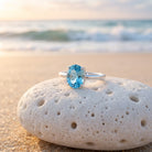Reef & Stone Ocean Blue Ring - blue topaz sterling silver ring on Australian beach
